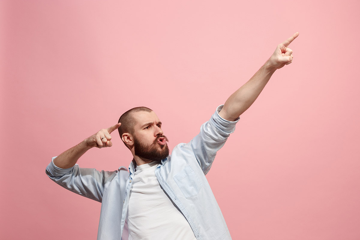 Man celebrates interest rate drop and increased activity in the real estate market.