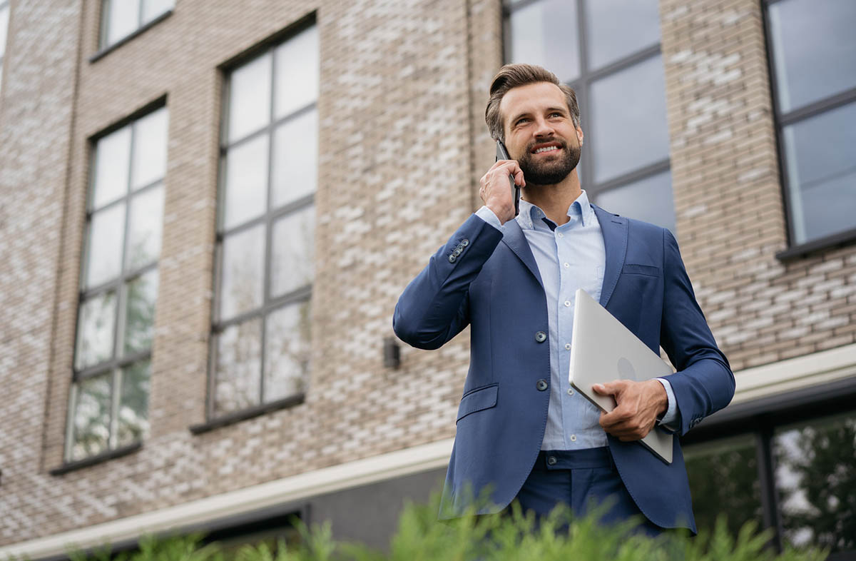 real estate agent talks on phone outside of property - do real estate investors need a license